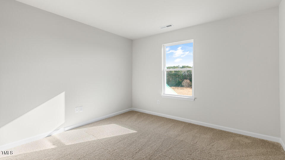 32 Red Clover Drive Angier, NC 27501 - Photo 25 of 38 a view of an empty room with a window