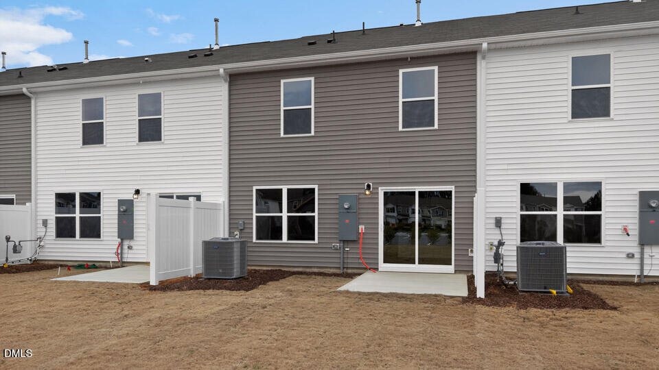 32 Red Clover Drive Angier, NC 27501 - Photo 34 of 38 a front view of a house with large windows