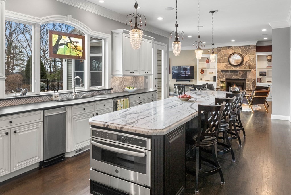 19 A Bayns Hill Road Boxford, MA 01921 - Photo 11 of 41 a open kitchen with a table and chairs in it