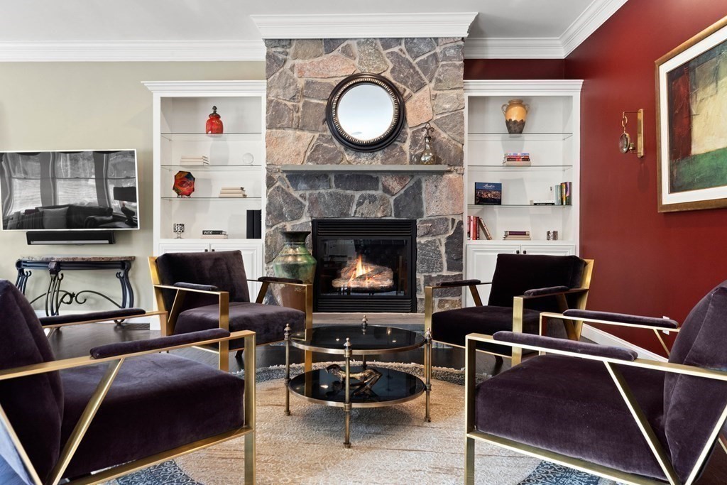 19 A Bayns Hill Road Boxford, MA 01921 - Photo 13 of 41 a living room with furniture a flat screen tv and a fireplace