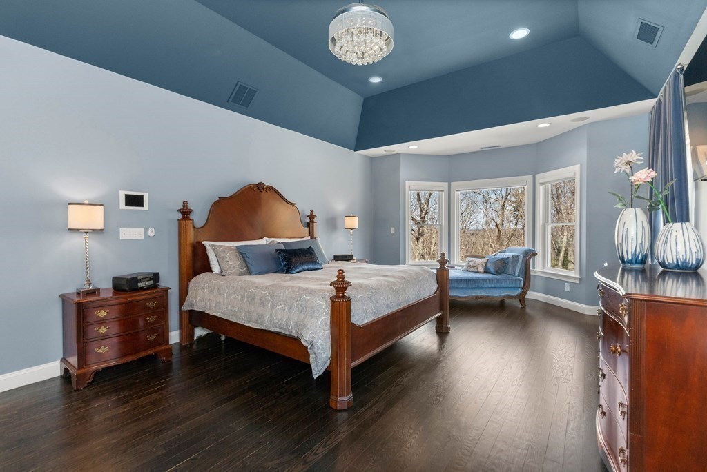 19 A Bayns Hill Road Boxford, MA 01921 - Photo 19 of 41 a bedroom with a bed and a chandelier