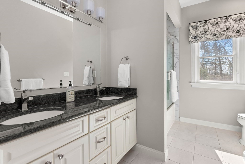19 A Bayns Hill Road Boxford, MA 01921 - Photo 27 of 41 a bathroom with a granite countertop sink a mirror and a shower