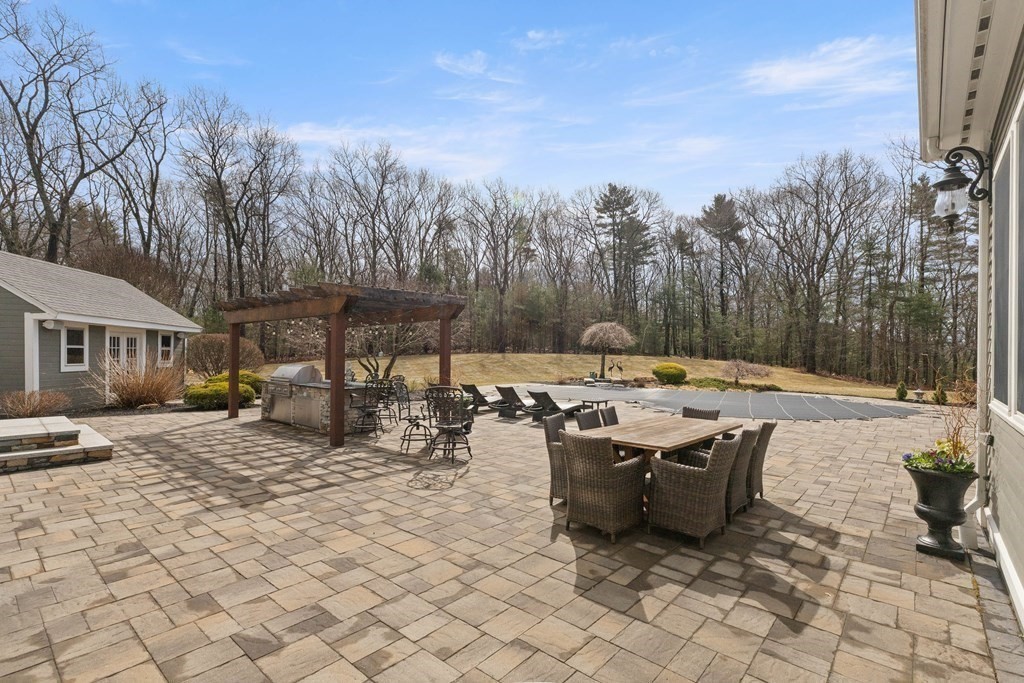 19 A Bayns Hill Road Boxford, MA 01921 - Photo 35 of 41 a view of a patio with a table and chairs