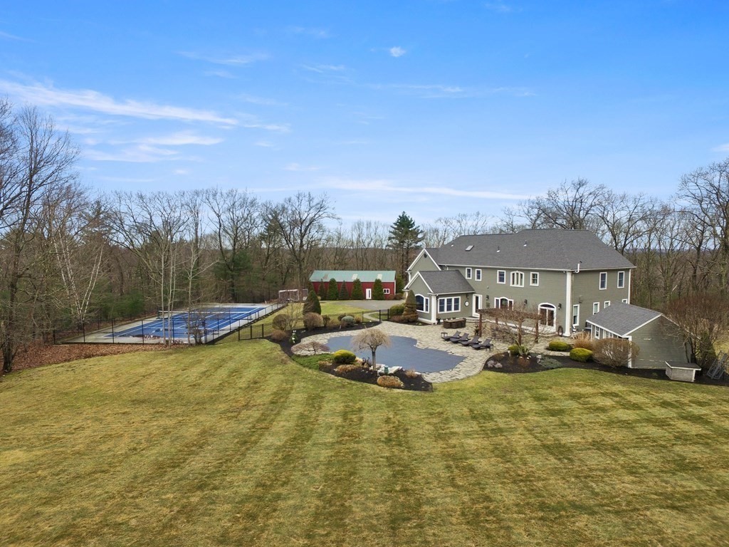 19 A Bayns Hill Road Boxford, MA 01921 - Photo 38 of 41 a view of a swimming pool with lawn chairs and plants