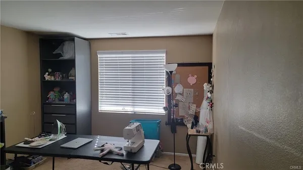 a view of a workspace with furniture