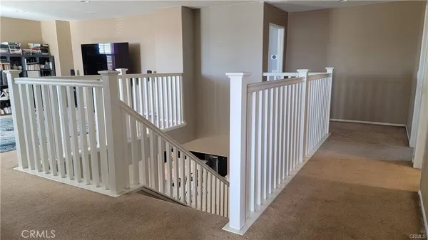 a view of a porch with wooden floor