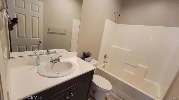 a view of a porch with wooden floor