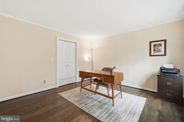 a workspace with furniture and wooden floor