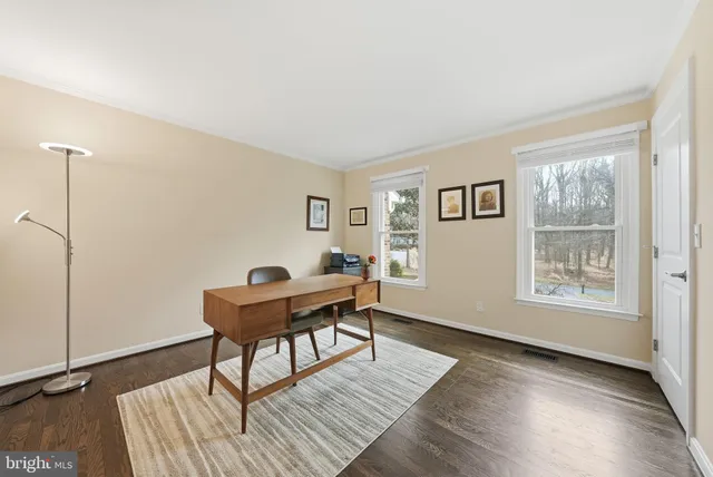 a workspace with furniture hardwood and a window