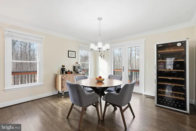 a dining room with furniture window wooden floor