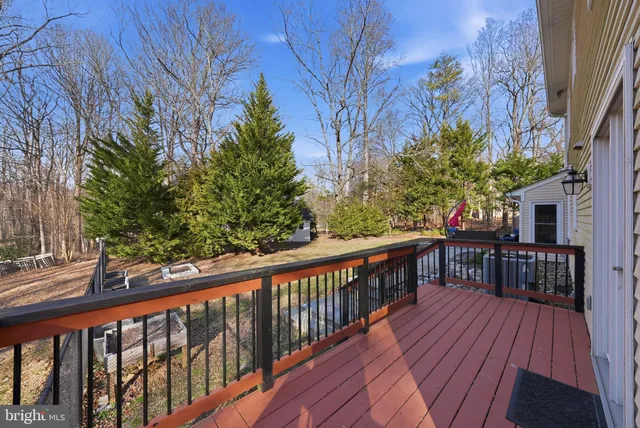 a view of a balcony with wooden floor