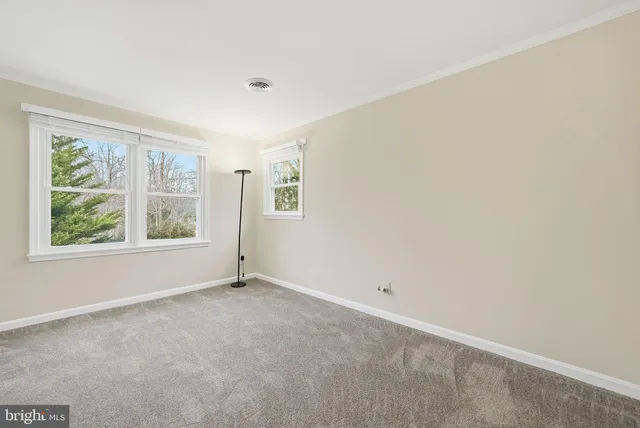 an empty room with windows