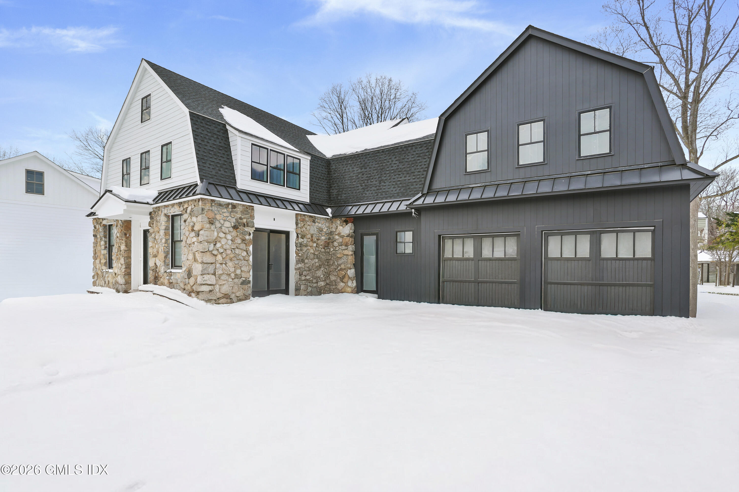 112 Sheep Hill Road Riverside, CT 06878 - Photo 26 of 30 a front view of a house with a yard