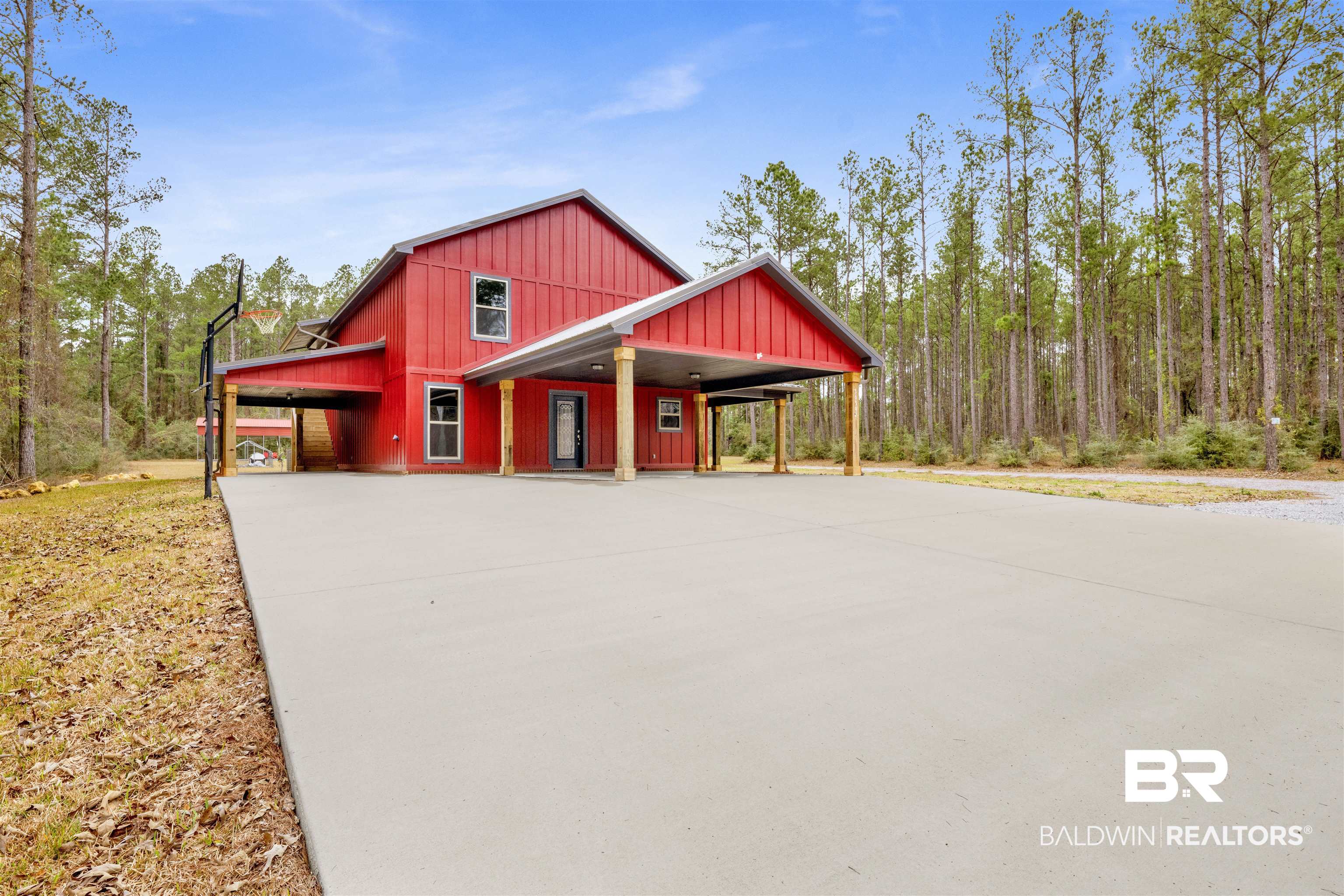 36397 Alexandria Trail Stapleton, AL 36578 - Photo 17 of 65 View of front of property featuring concrete driveway, a carport, board and batten siding, and a porch