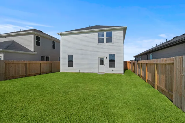 a view of a backyard of the house