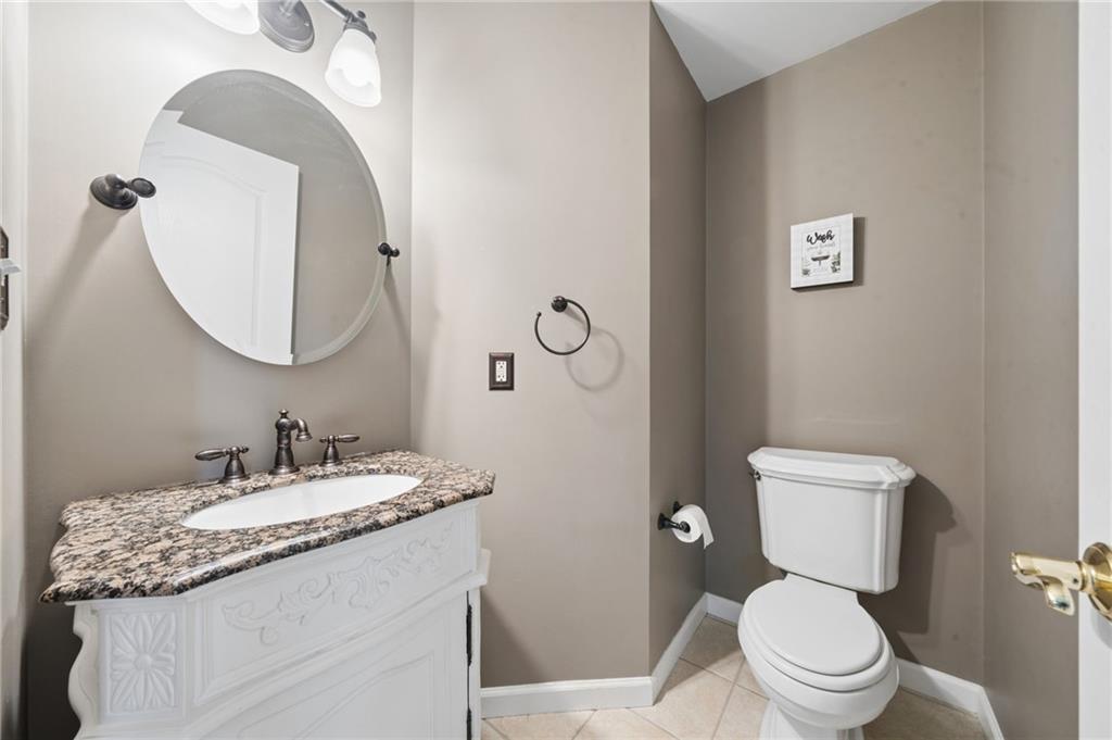 481 Sawmill Road Greensburg, PA 15601 - Photo 16 of 39 a bathroom with a granite countertop toilet sink and mirror