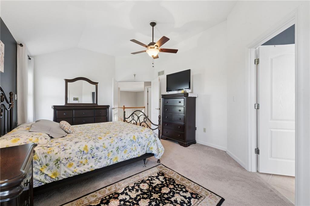 481 Sawmill Road Greensburg, PA 15601 - Photo 20 of 39 a bedroom with a bed and a chandelier