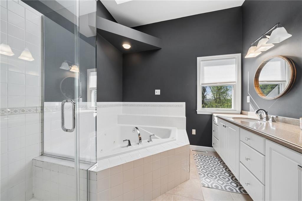 481 Sawmill Road Greensburg, PA 15601 - Photo 21 of 39 a bathroom with a tub sink and mirror