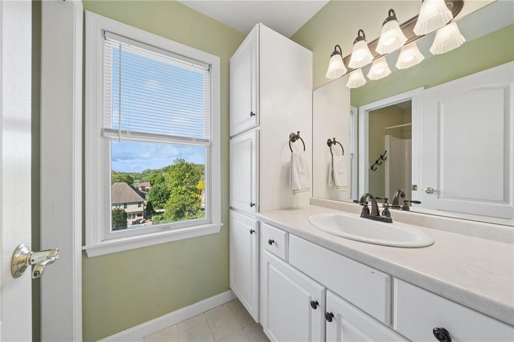 481 Sawmill Road Greensburg, PA 15601 - Photo 25 of 39 a bathroom with a sink vanity and a mirror