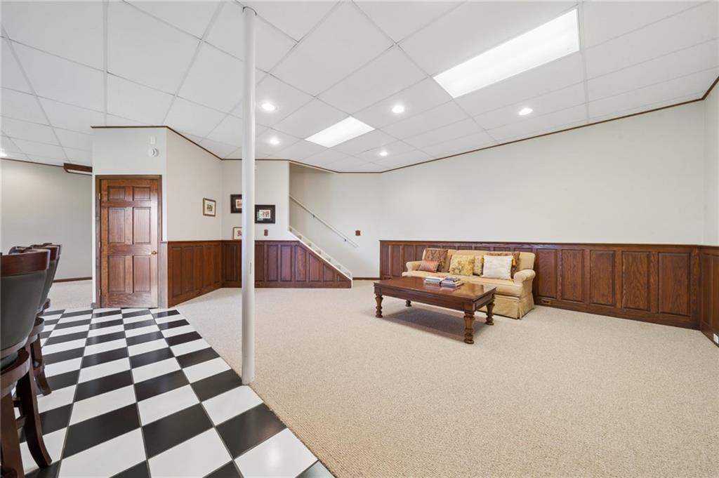 481 Sawmill Road Greensburg, PA 15601 - Photo 31 of 39 a hallway with a black white checkered floor kitchen view and living room view