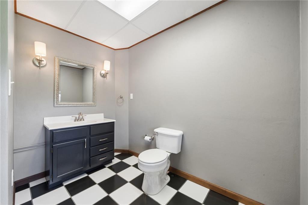 481 Sawmill Road Greensburg, PA 15601 - Photo 32 of 39 a bathroom with a toilet a sink and mirror