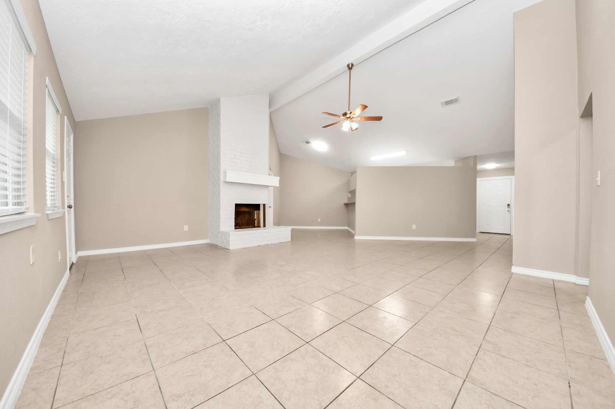 6603 Brookgate Drive Spring, TX 77373 - Photo 3 of 22 Big Family Room with wood burning fireplace open to the dining room with a peek through from the kichen.