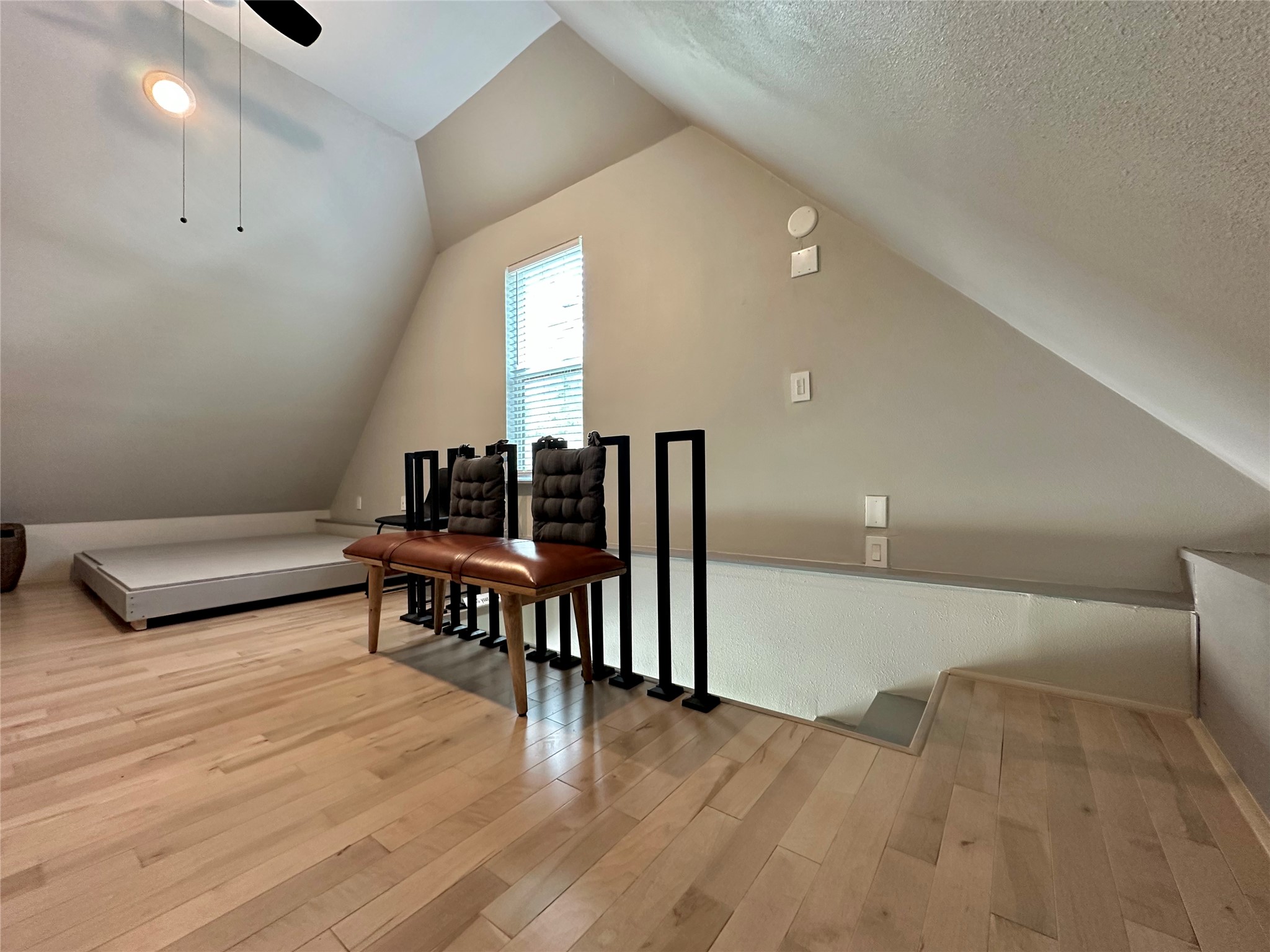 914 East 39th Street, Unit 2 Austin, TX 78751 - Photo 16 of 34 Additional living space featuring light wood-type flooring, lofted ceiling, and a ceiling fan