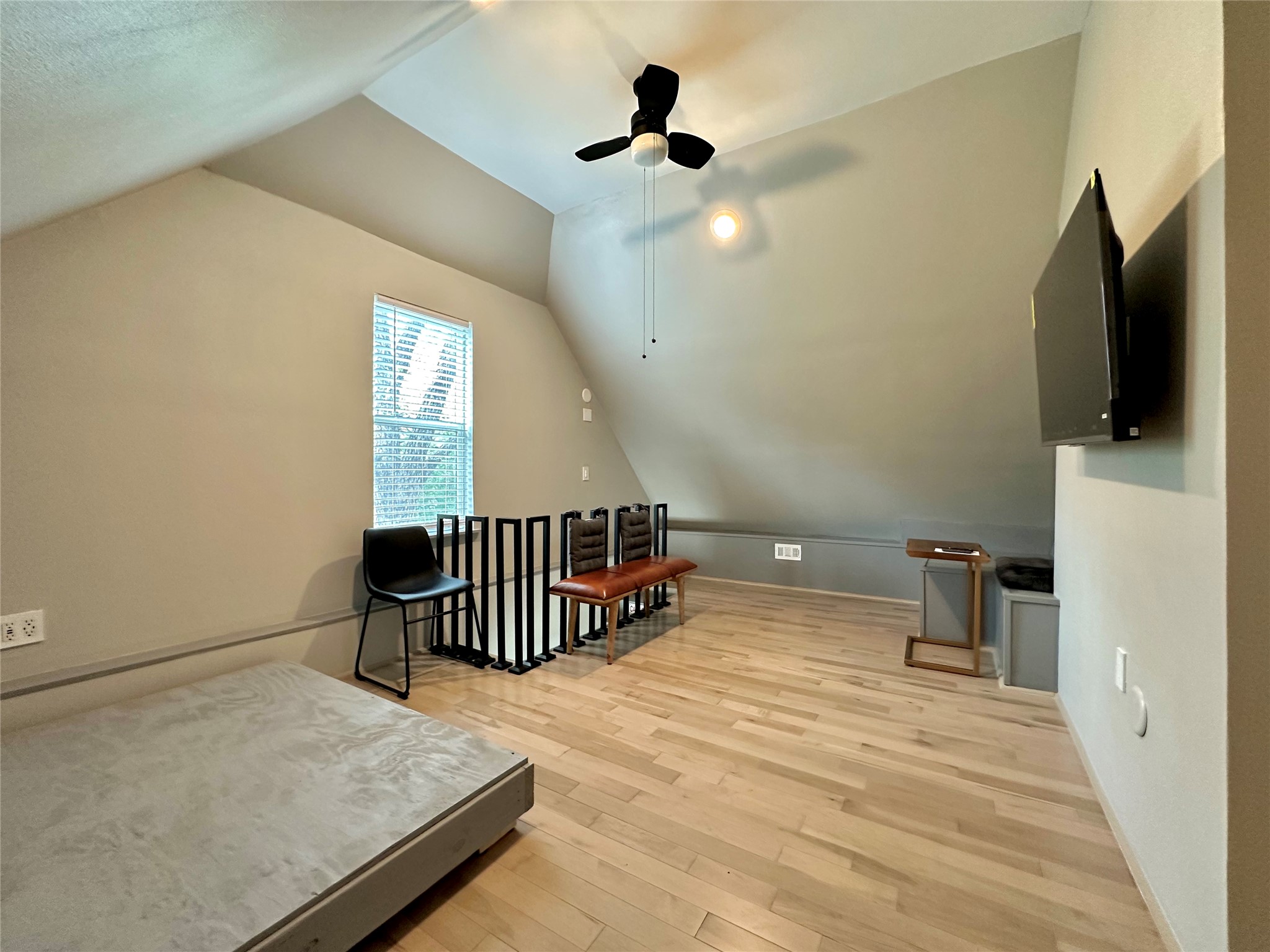 914 East 39th Street, Unit 2 Austin, TX 78751 - Photo 17 of 34 Bonus room with ceiling fan and light wood-style floors