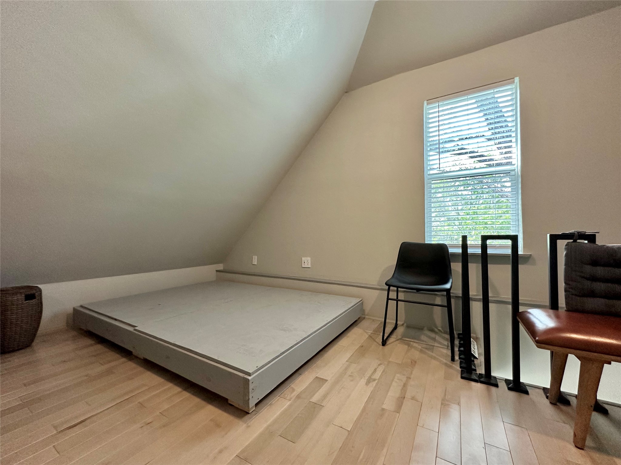 914 East 39th Street, Unit 2 Austin, TX 78751 - Photo 21 of 34 Bedroom with vaulted ceiling and light wood-style floors