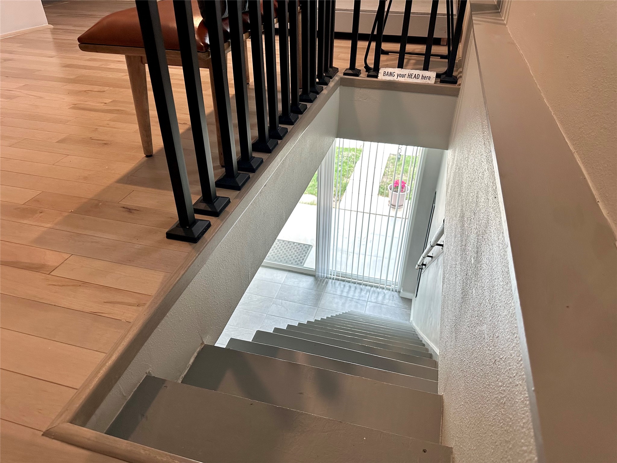 914 East 39th Street, Unit 2 Austin, TX 78751 - Photo 30 of 34 Stairway featuring a textured wall and wood finished floors