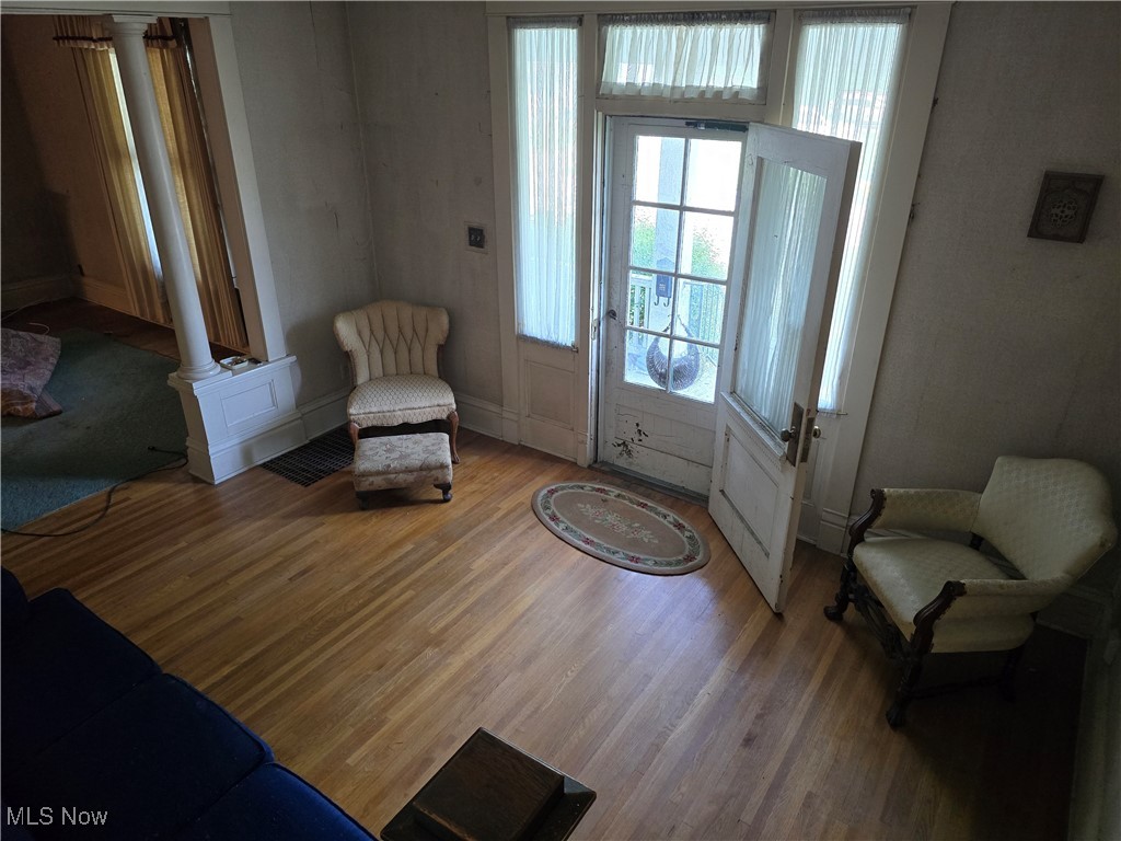 610 Dryden Road Zanesville, OH 43701 - Photo 2 of 13 Sitting room featuring decorative columns and wood finished floors