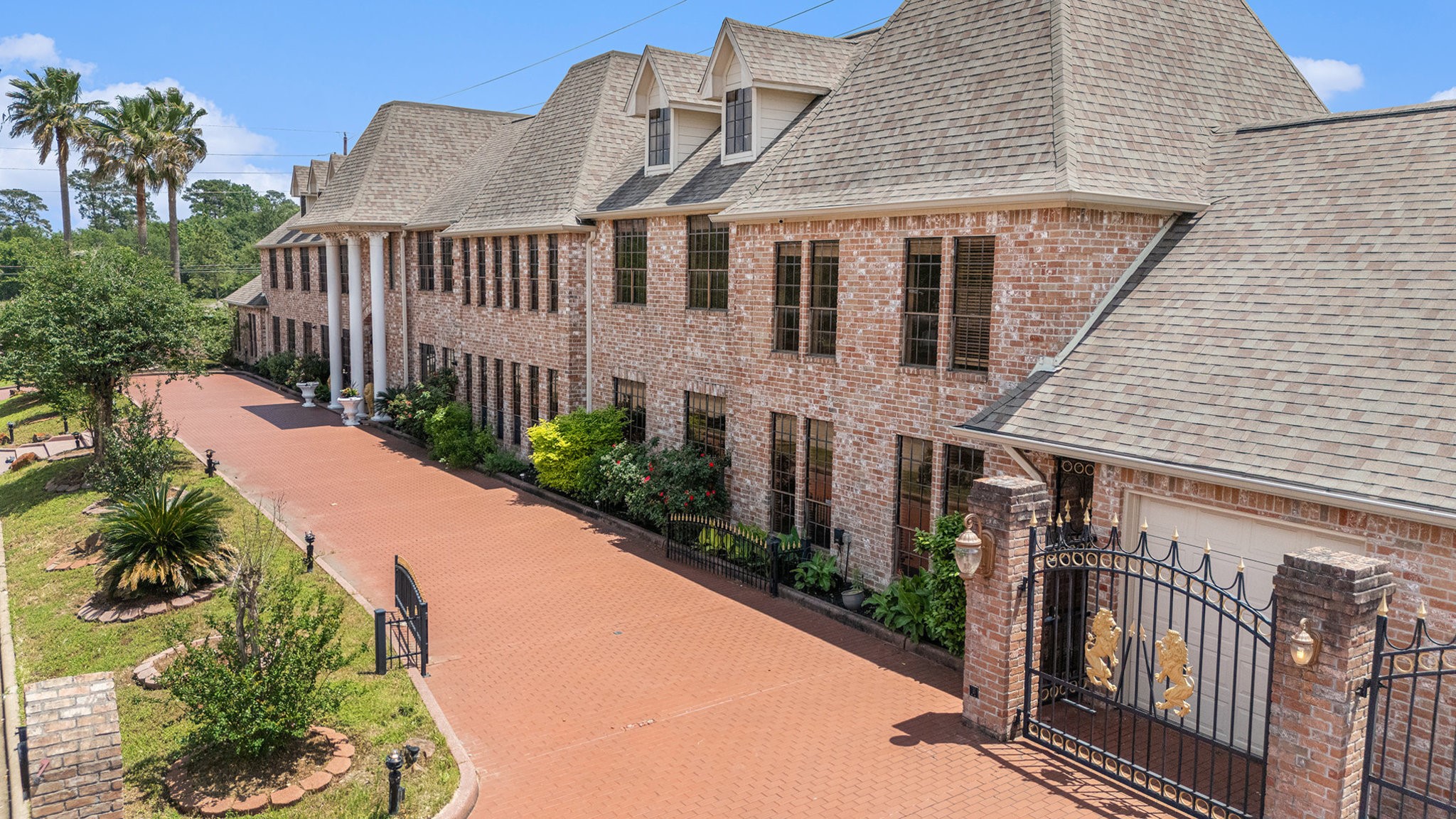 a view of a house with wooden fence