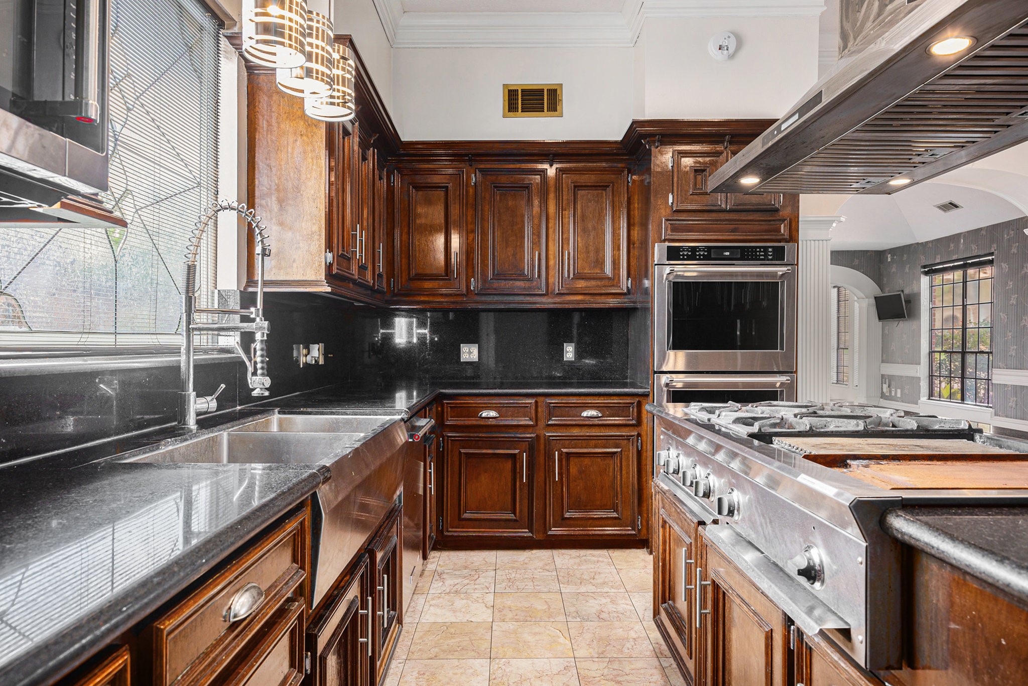 7415 Naremore Drive Spring, TX 77379 - Photo 17 of 47 a kitchen with stainless steel appliances granite countertop a sink and a stove