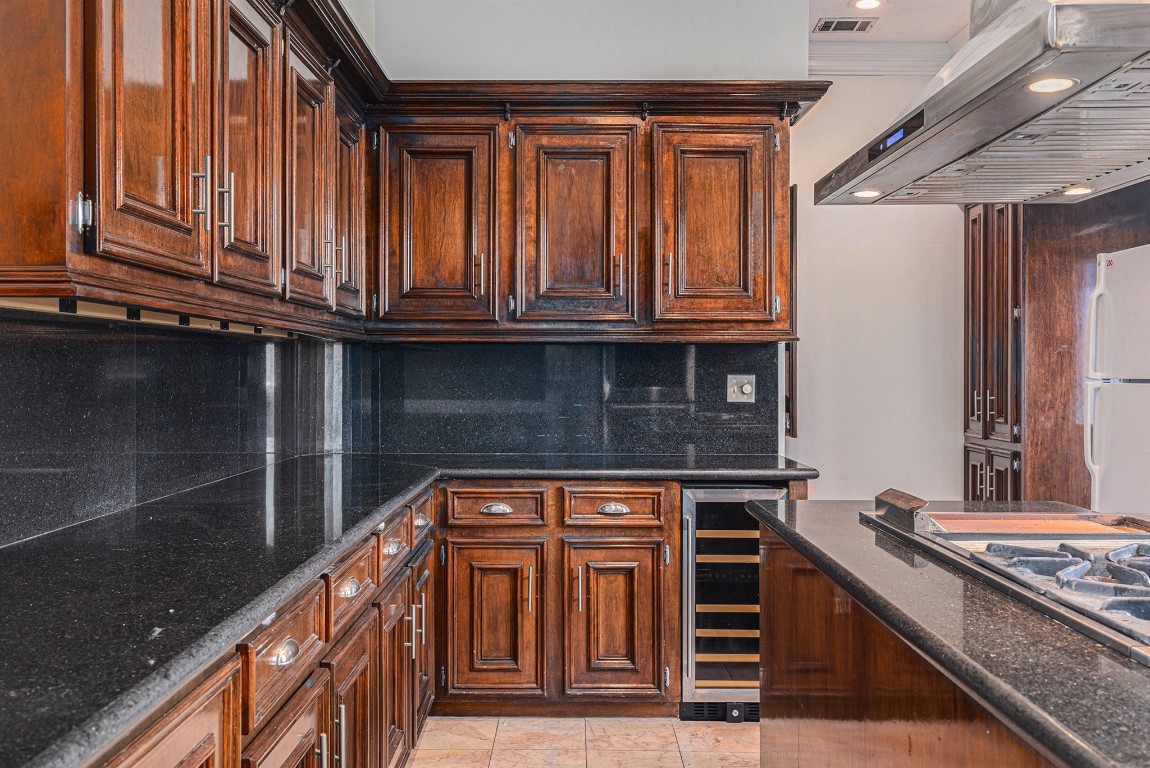 7415 Naremore Drive Spring, TX 77379 - Photo 18 of 47 a kitchen with granite countertop a stove and cabinets