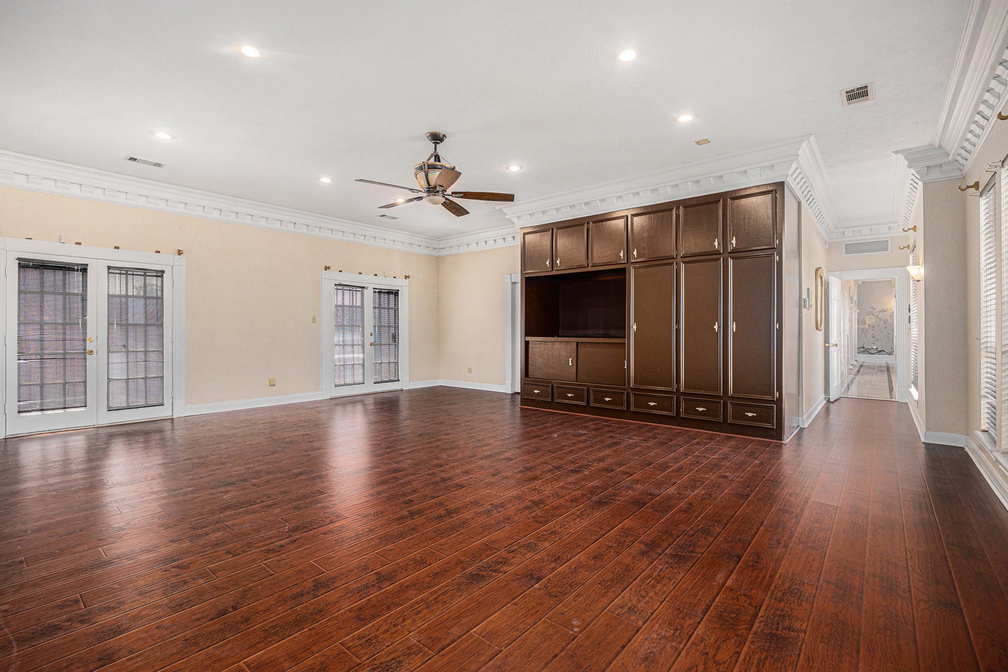 7415 Naremore Drive Spring, TX 77379 - Photo 21 of 47 a view of an empty room with wooden floor and a window