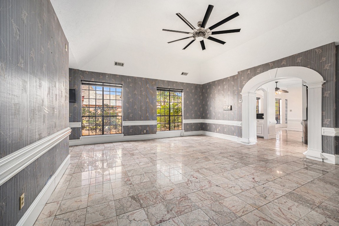 7415 Naremore Drive Spring, TX 77379 - Photo 25 of 47 a view of an empty room with a window and a kitchen