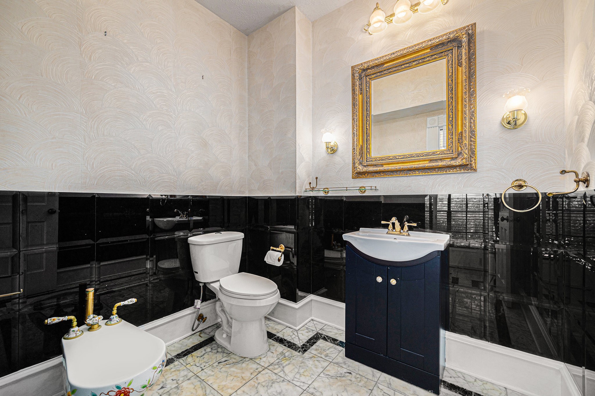 7415 Naremore Drive Spring, TX 77379 - Photo 29 of 47 a bathroom with a toilet a sink and mirror