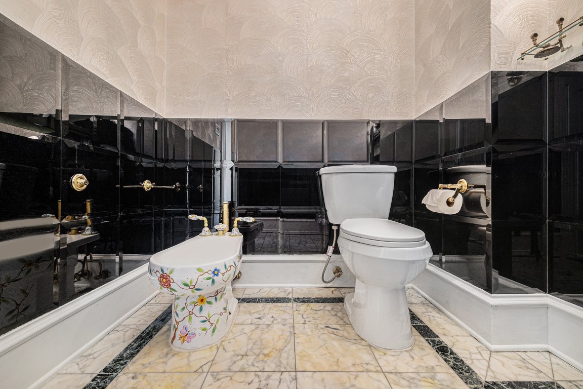 7415 Naremore Drive Spring, TX 77379 - Photo 30 of 47 a bathroom with a toilet a sink and mirror