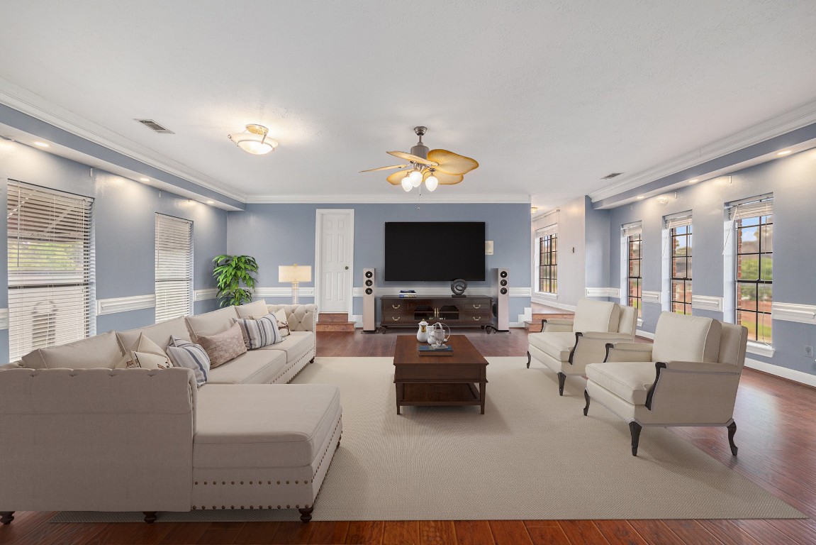 7415 Naremore Drive Spring, TX 77379 - Photo 32 of 47 a living room with furniture and a flat screen tv