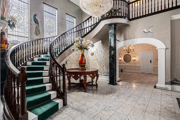 a spacious bathroom with a sink a mirror and a shower