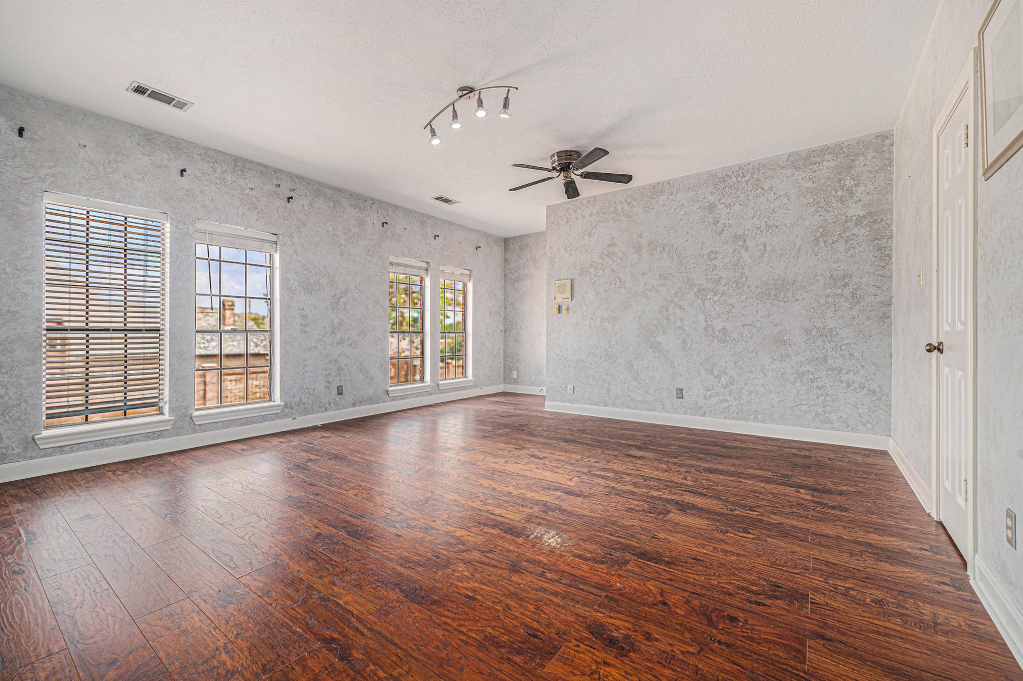 7415 Naremore Drive Spring, TX 77379 - Photo 42 of 47 a view of empty room with wooden floor and fan