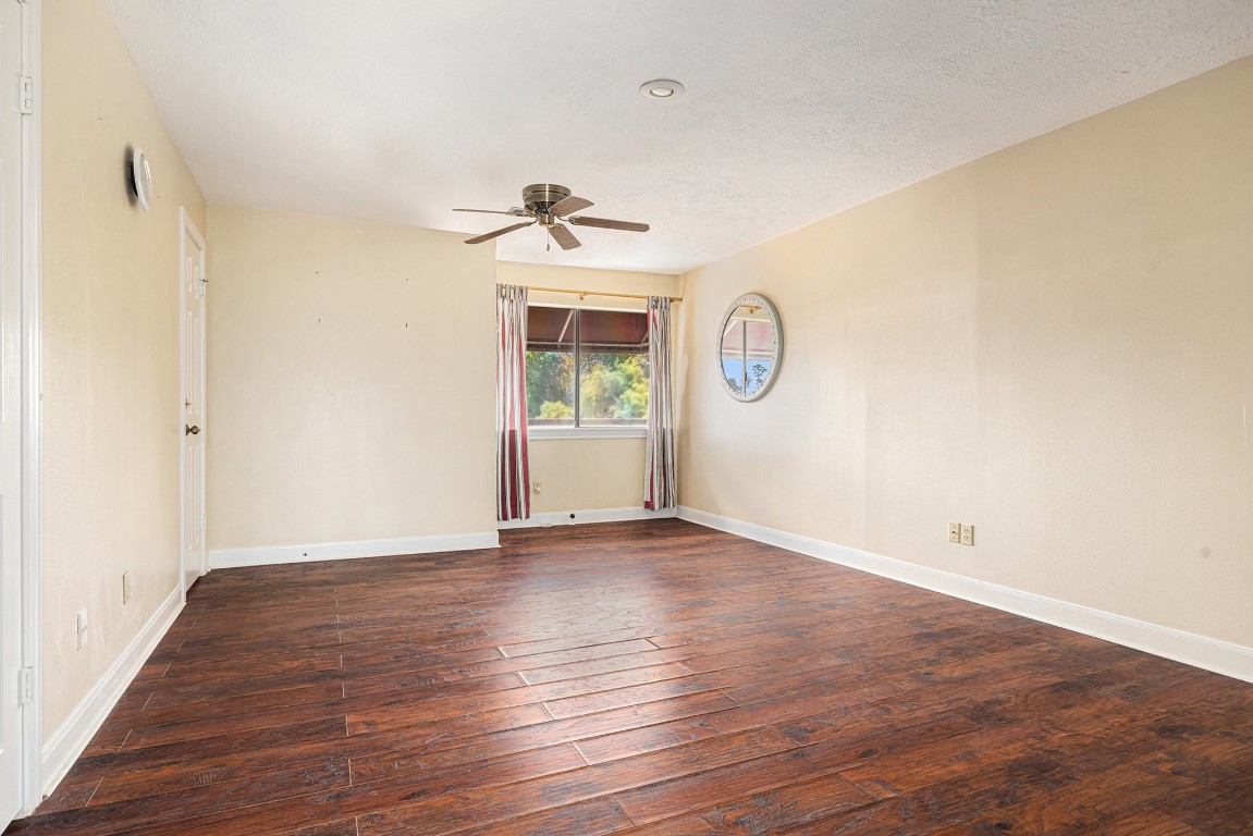 7415 Naremore Drive Spring, TX 77379 - Photo 44 of 47 a view of an empty room with window and wooden floor