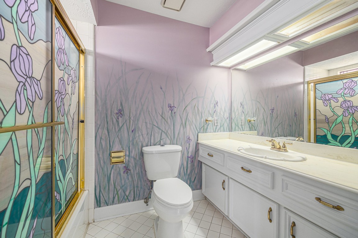 7415 Naremore Drive Spring, TX 77379 - Photo 45 of 47 a bathroom with a toilet sink and mirror