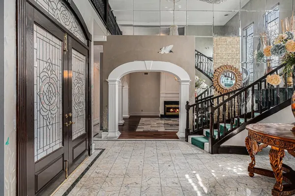 a kitchen with stainless steel appliances granite countertop a sink and a stove
