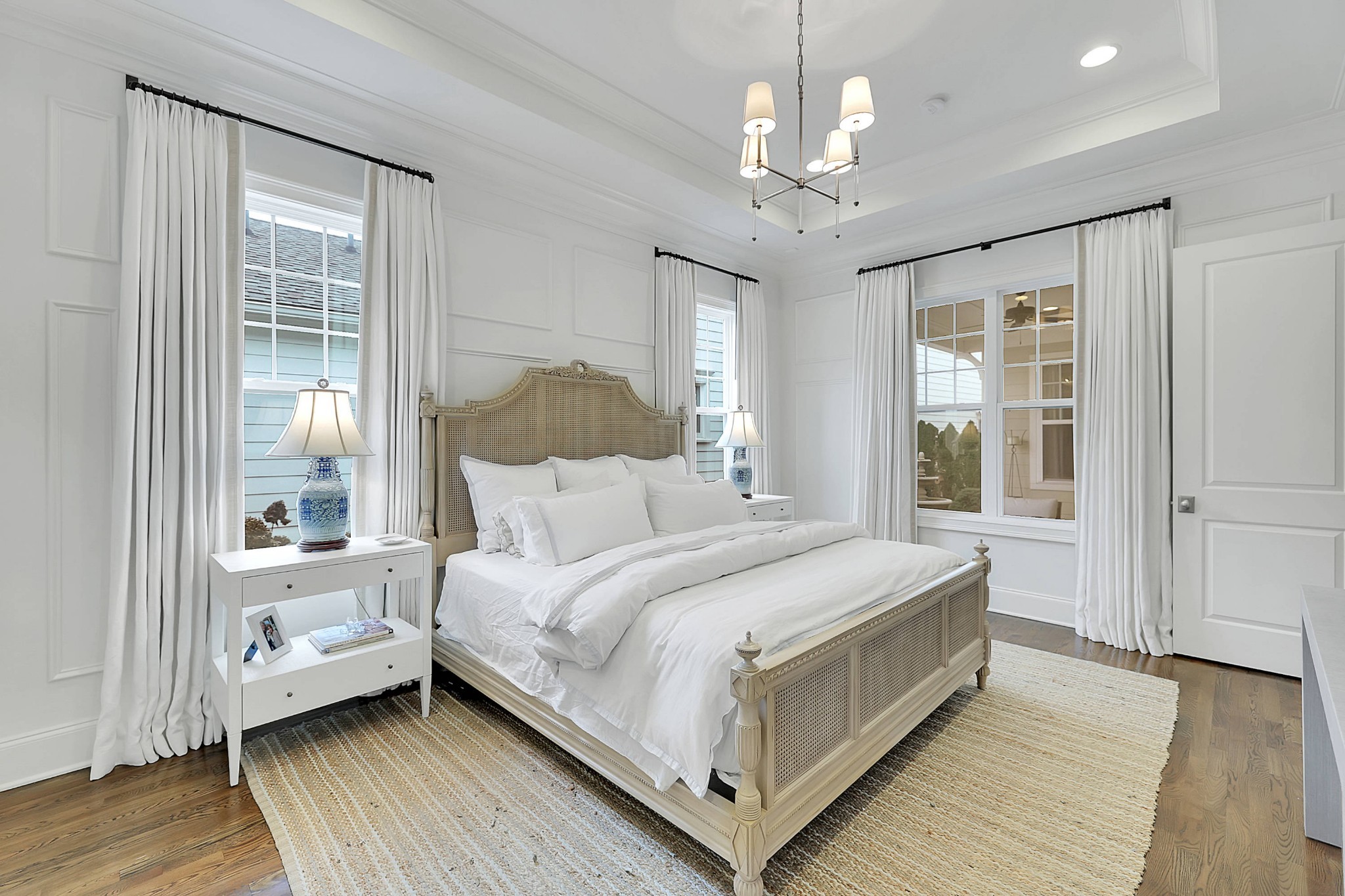 2012 General Martin Lane Franklin, TN 37064 - Photo 27 of 66 a bedroom with a large bed and a chandelier
