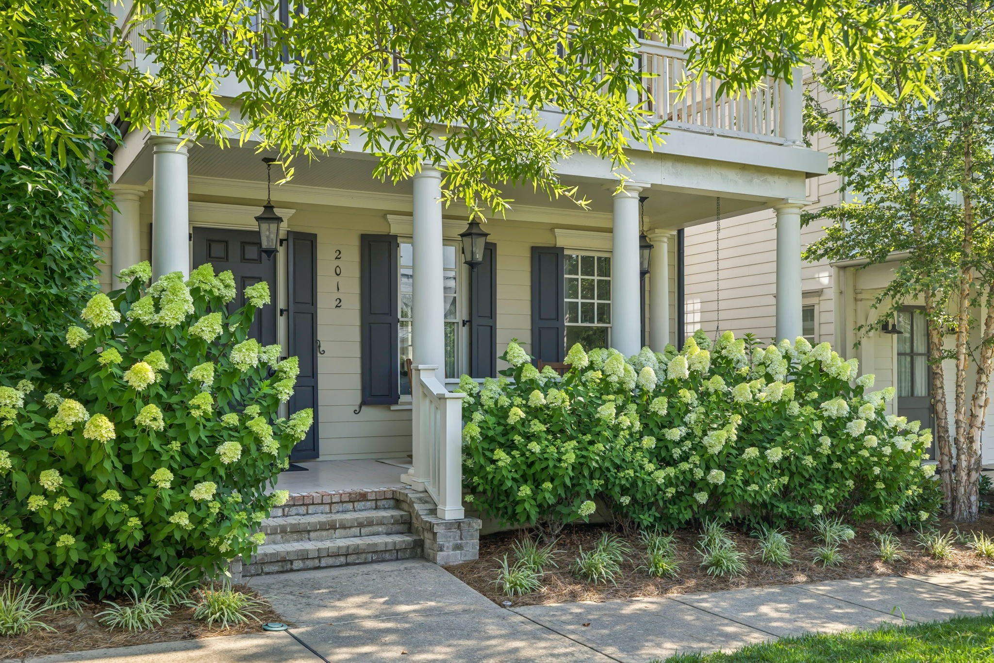 2012 General Martin Lane Franklin, TN 37064 - Photo 4 of 66 a view of a house with potted plants and a large tree