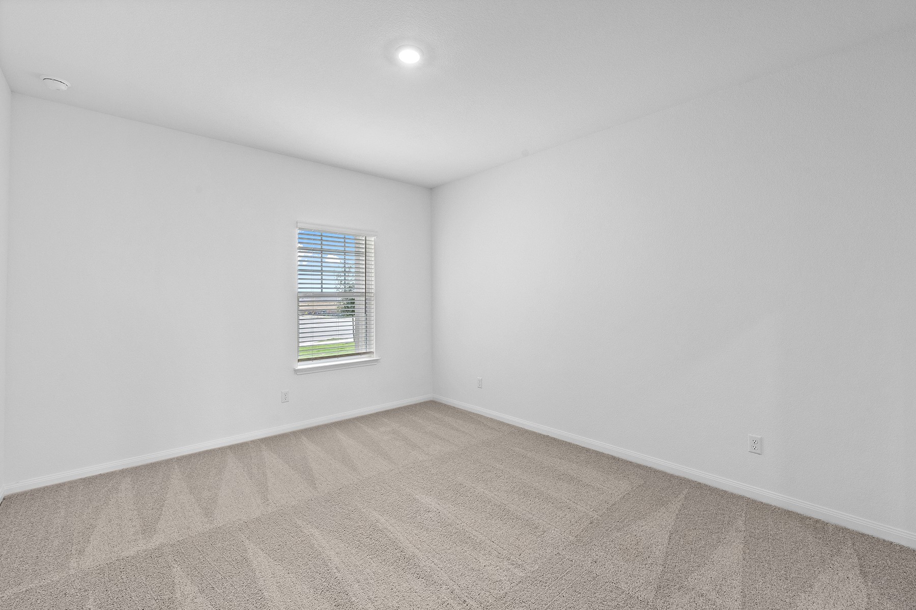 14408 Wahlbergs Way Elgin, TX 78621 - Photo 7 of 14 a view of an empty room with a window