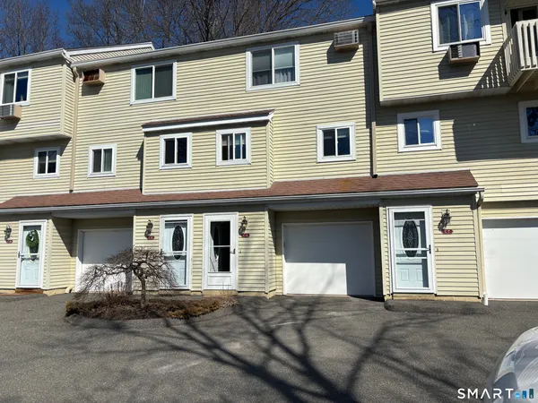 a front view of a house with a garage