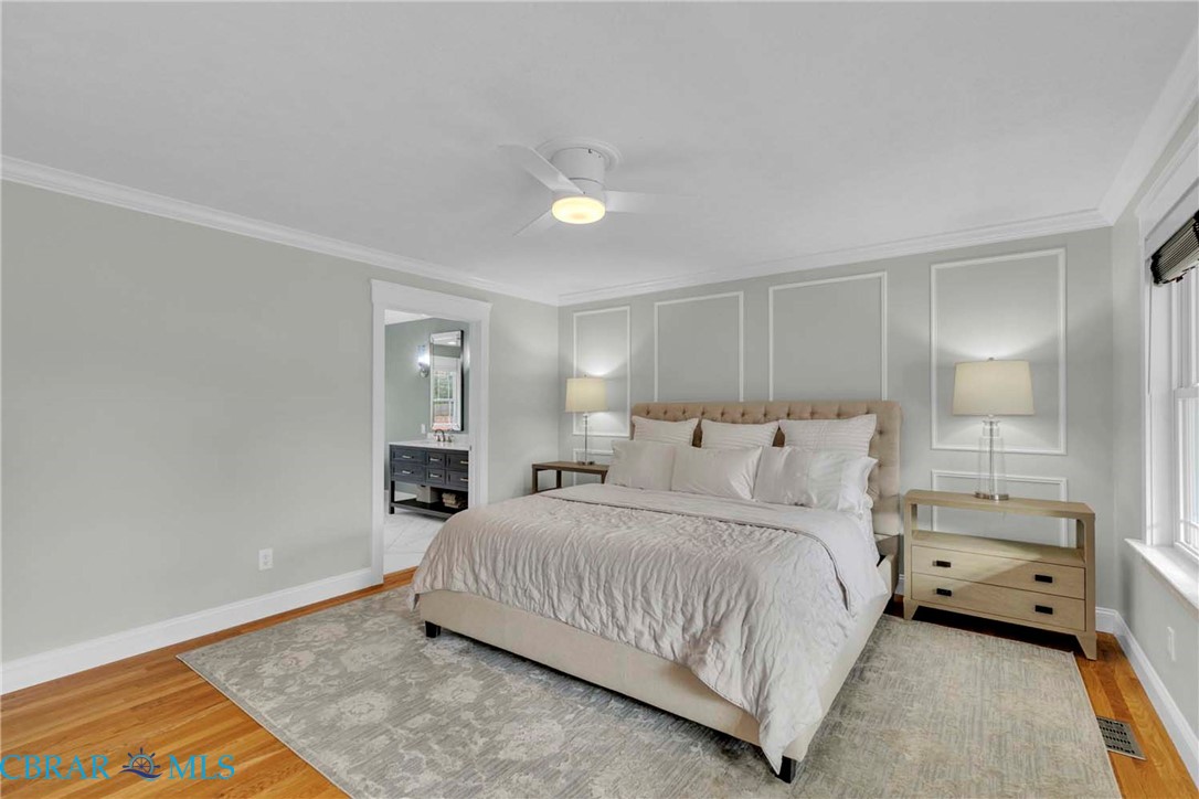 411 Hookemfair Road Cobbs Creek, VA 23035 - Photo 23 of 50 1st floor large Primary bedroom with hardwood floors, large primary bathroom and walk in custom closet
