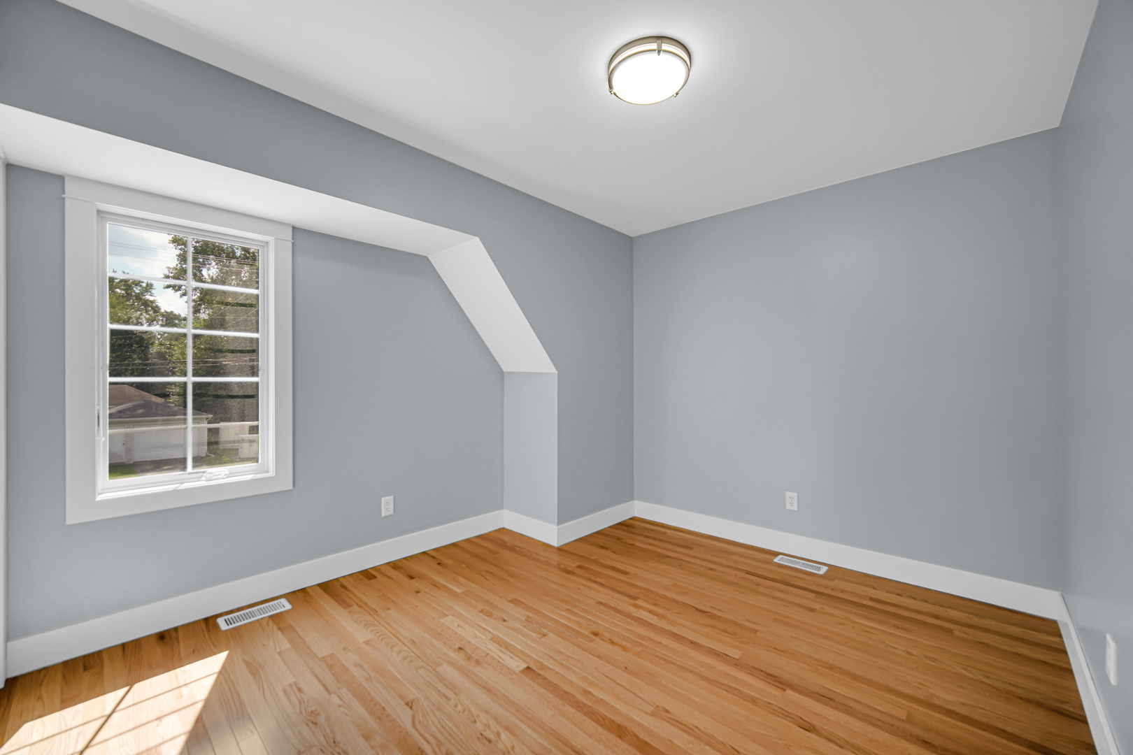 18462 Dixie Highway Homewood, IL 60430 - Photo 21 of 25 an empty room with wooden floor and windows